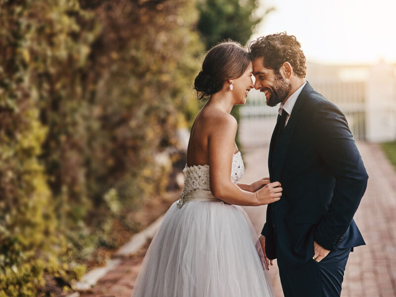 You're my wife now. Shot of a happy young couple standing together on their wedding day