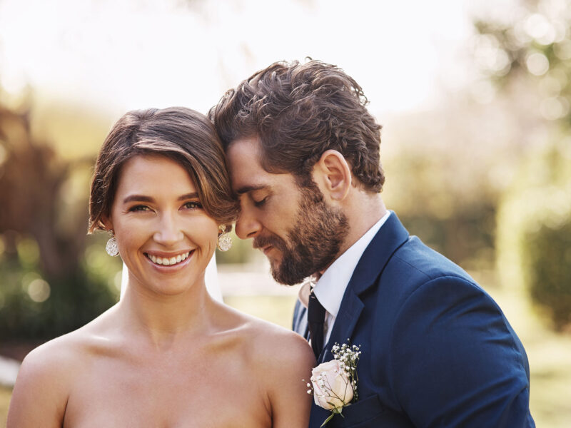 I know our marriage is going to be a happy one. Cropped shot of an affectionate young bride smiling while standing outdoors with her groom on their wedding day.